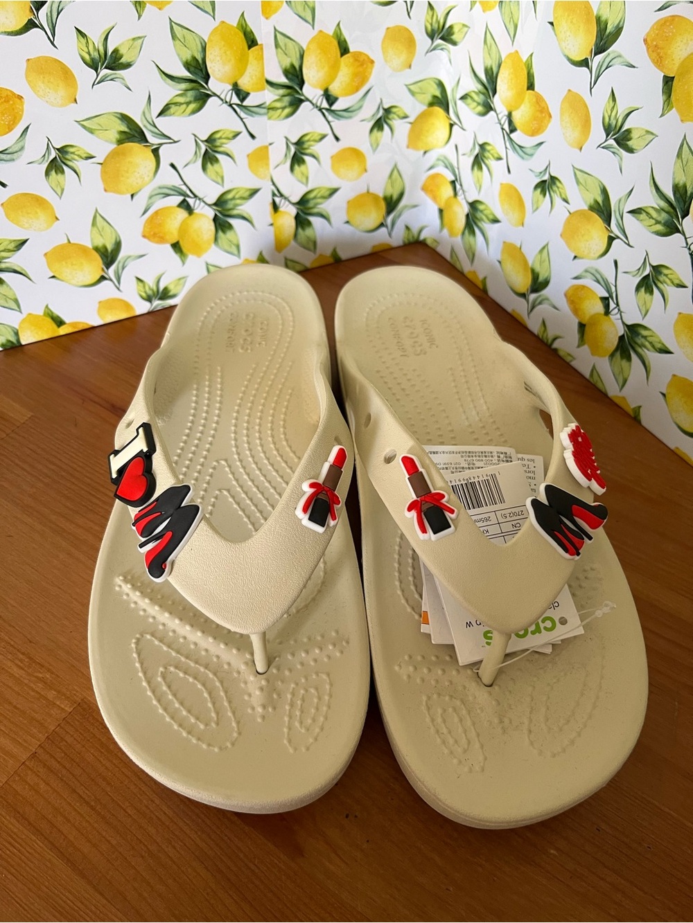 CROCS Women’s Cream Flip Flops with Red & Black Decorative Charms Size 10W